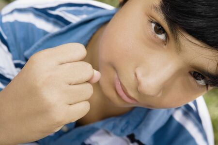 Hispanic boy making fistの写真素材