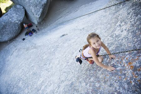 Asian girl rock climbingの写真素材