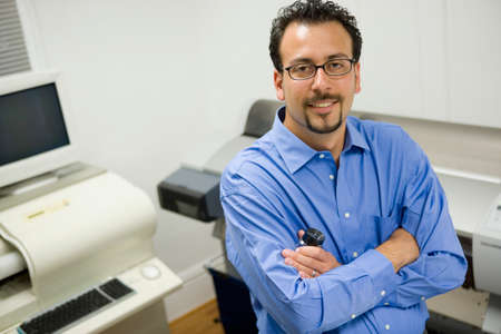 Hispanic businessman with arms crossed