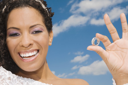 Hispanic bride holding ringの写真素材