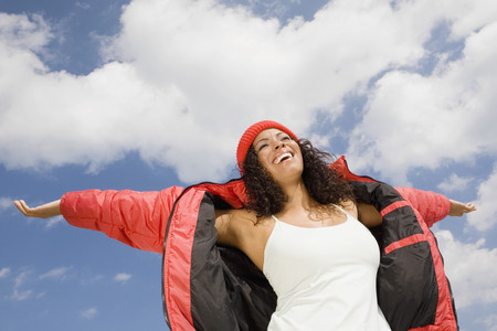 Hispanic woman with arms outstretchedの写真素材