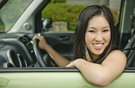 Asian teenager driving car