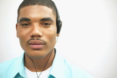 Portrait of a young man wearing headphonesの写真素材