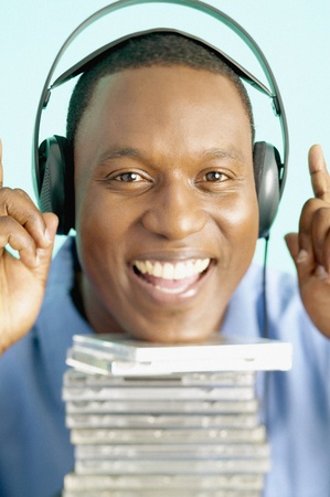 Portrait of a mid adult man wearing headphones smilingの写真素材