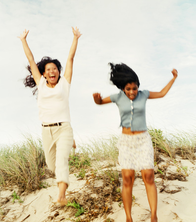 Two women jumpingの写真素材