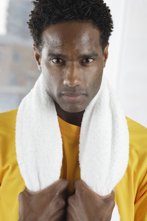 Portrait of a mid adult man holding a towelの写真素材