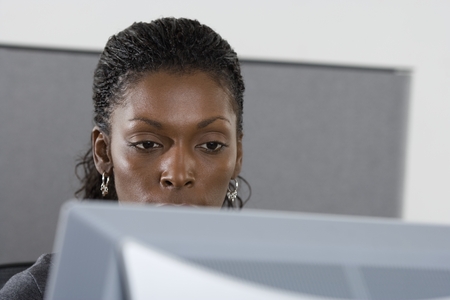 Woman in office working on computerの写真素材