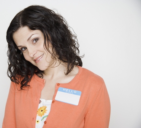 Portrait of woman with name tag onの写真素材