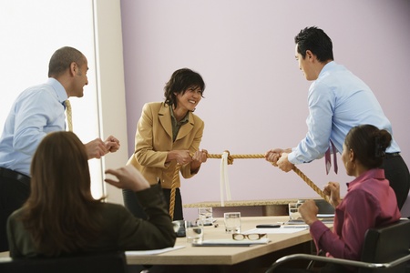 Businesspeople playing tug of warの写真素材