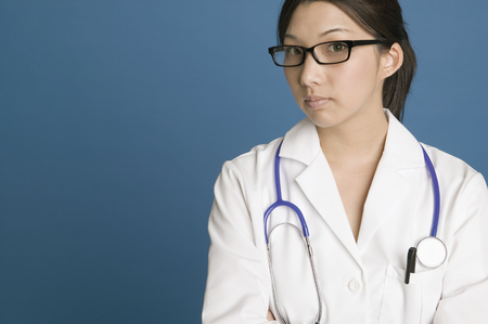 Young female doctor posing for the cameraの写真素材
