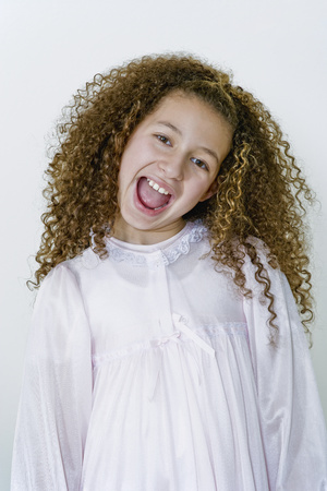 Mixed race girl in nightgownの写真素材