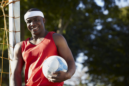 Black man holding soccer ballの写真素材