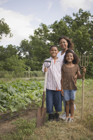 African mother and children in gardenの写真素材
