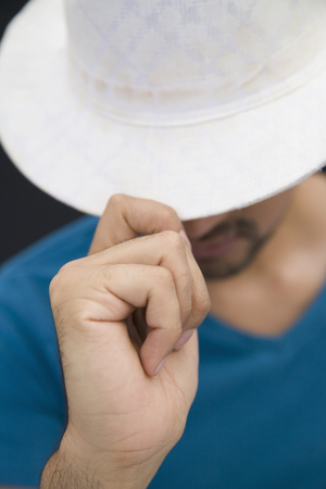 Hispanic man in white fedora hatの写真素材