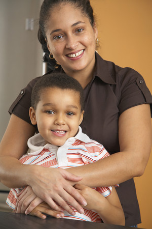 Dominican mother hugging sonの写真素材