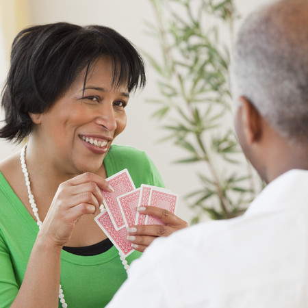 African couple playing cardsの写真素材