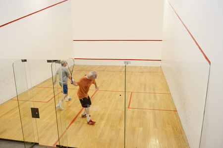 Hispanic men playing racquetballの写真素材