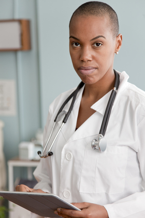 Serious Black doctor using digital tabletの写真素材