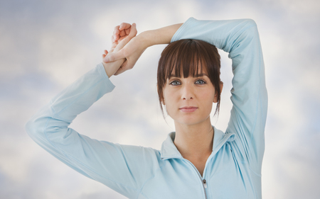 Caucasian woman with arms raisedの写真素材
