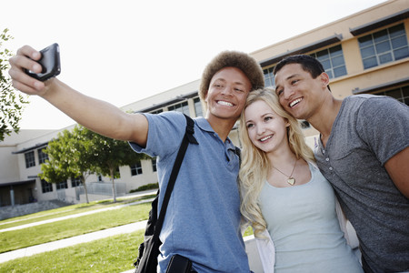 School friends taking self-portrait
