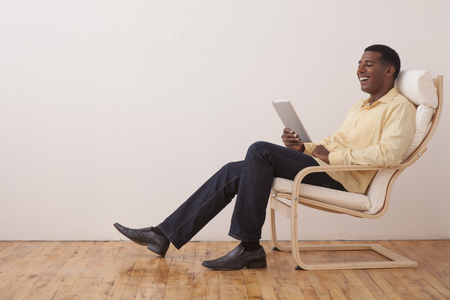 Black man using digital tabletの写真素材