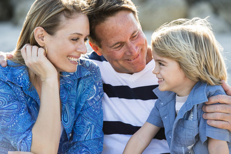 Family smiling together outdoors