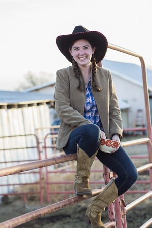 Caucasian girl smiling on farmの写真素材