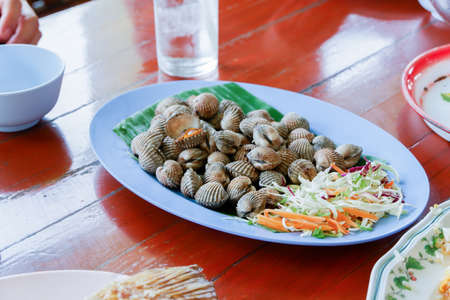 Grilled Cockle or Anadara granosa in the plate.の写真素材