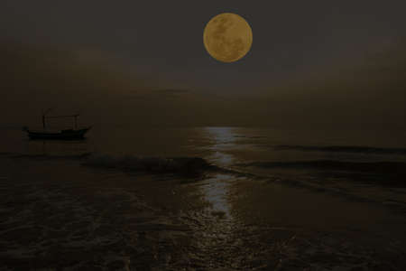 Full moon on sky over sea at night.の写真素材