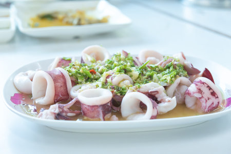 Steamed squid with spicy and sour sauce.の写真素材