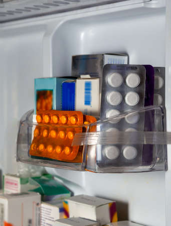 Medications are placed on the shelves of the refrigerator for storage. Medicines for various diseases.の写真素材