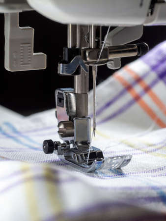 Sewing machine sew fabric. Close-up needle, thread, fabric and mechanism of a sewing machine....