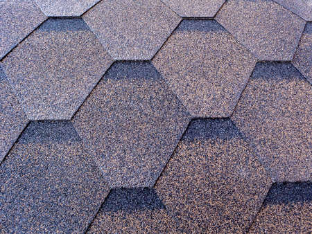 Flexible tiles with basalt granulate in the form of hexagons cover the entire surface of the background. Construction abstract background with tiles. Clean place for text.の写真素材