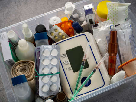 The basic set of medicines for first aid. First aid kit with medicines and medical products. Medical background.の写真素材