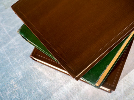 Old books are stacked on the table. Books are shifted relative to each other. view from above. close-up. The concept of education, scientific work.の写真素材