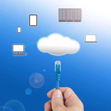Officeman hold  Network cable  connect to cloud computing service with blue background