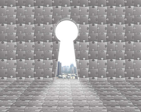 Key shape door on puzzles wall with city view outside backgroundの写真素材
