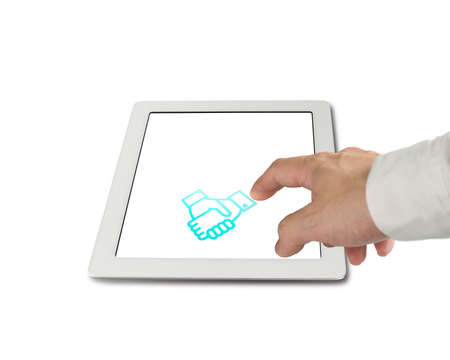 Hand touching shake hand icon on tablet pc screen isolated in white backgroundの写真素材