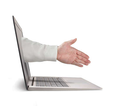 Business man hand reaching out from screen to shake with, isolated in whiteの写真素材