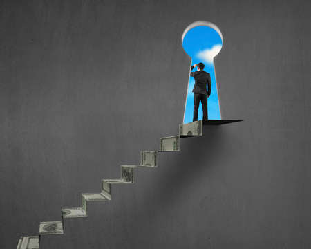 Grazing with money stairs and key hole with blue sky outsideの写真素材