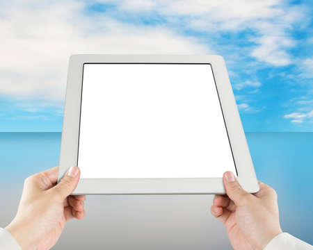 Holding tablet with sky reflection glass table