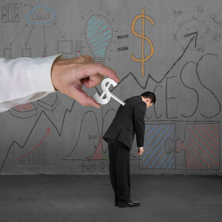 Winding money winder on man with business doodles on concrete wall background
