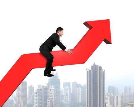 Businessman riding on red arrow with cityscape backgroundの写真素材