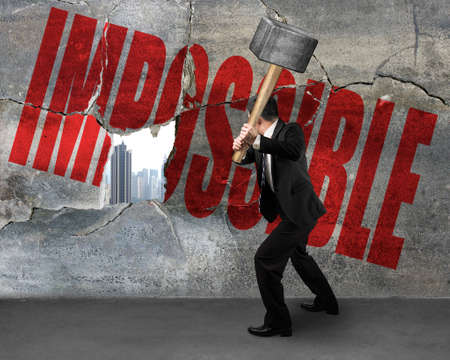 Man Cracked wall with impossible word it city building outsideの写真素材