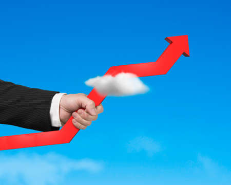 Man Graping growing red arrow through cloud in blue skyの写真素材