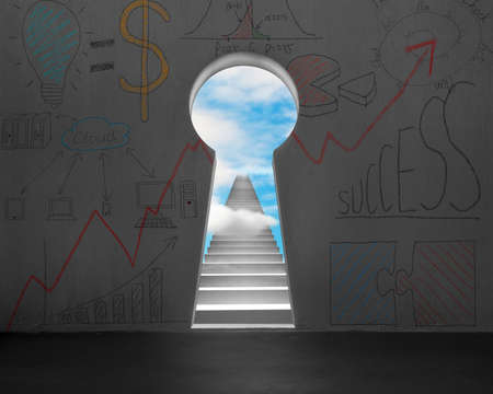 Key shape door on wall with stairs and blue sky outsideの写真素材