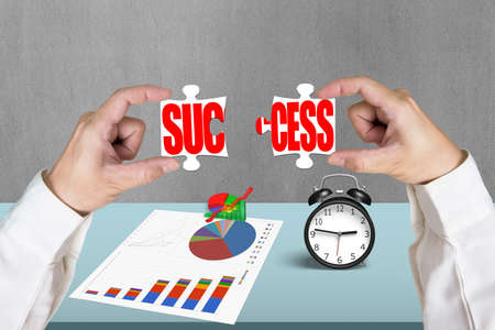 Put two puzzles together for success in officeの写真素材