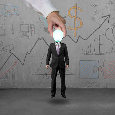 Picking up man in lamp head with doodlesの写真素材