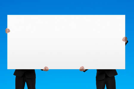 Holding blank billboard in blue の写真素材