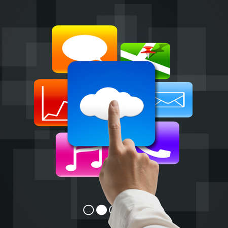 forefinger pointing at cloud computing with colorful app icons on tech background